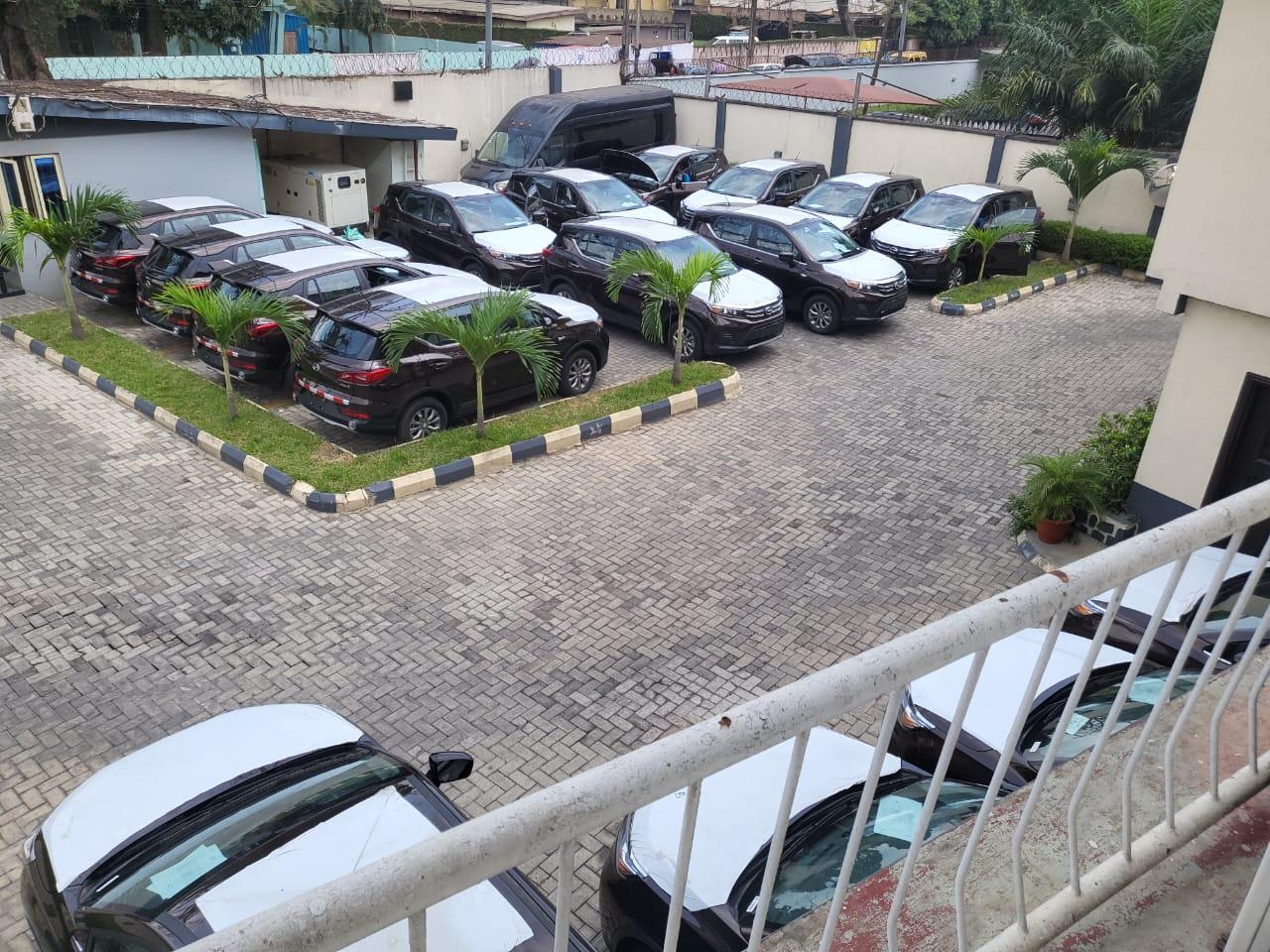 Onealpha fleet vehicles parked in rows at the company yard